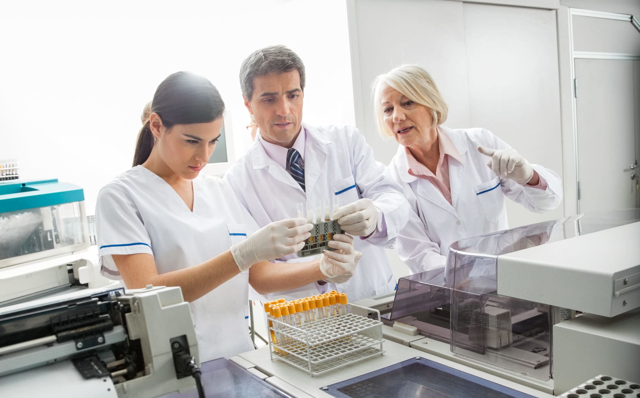 Covid testing monitor medical team analysing sample